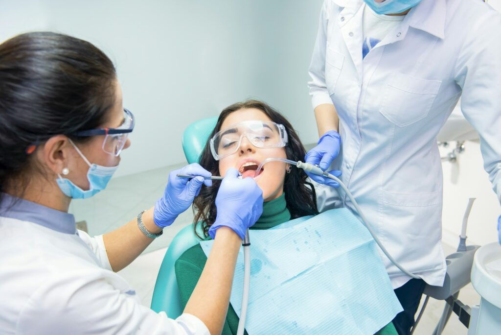 Dentists working with patient